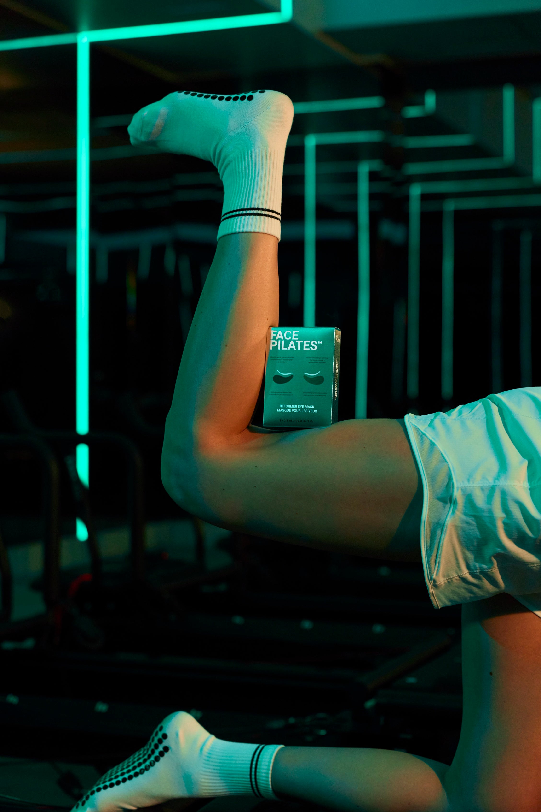 Face Pilates eye mask at the gym — neon fitness lifestyle